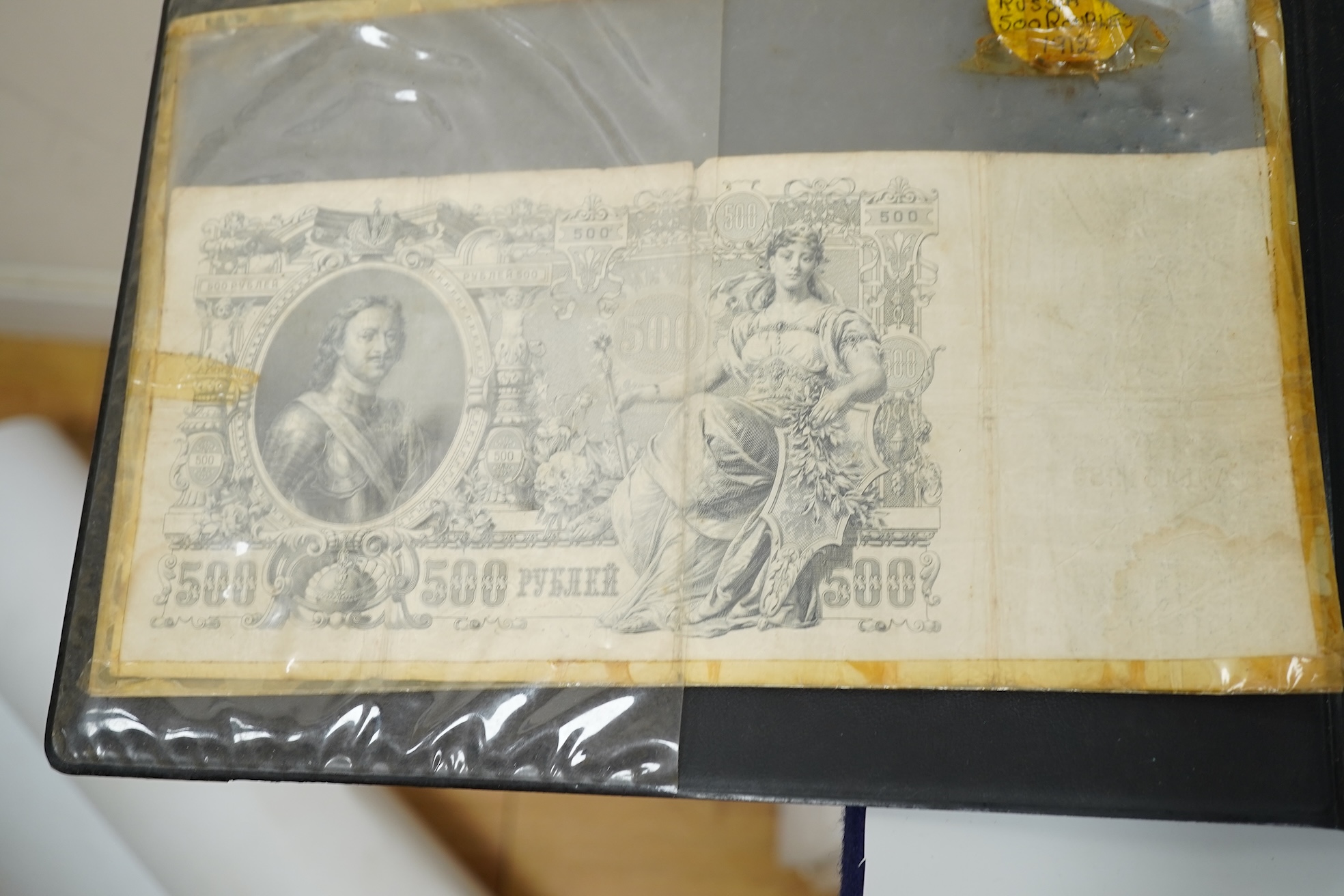 A collection of various coinage in an album, mostly George V to QEII